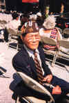 Filipino American veteran watches Philippine Centennial presentations staged by the City of Chicago as well as various Filipino American organizations in honor of Filipino American World War II veterans. They fought side by side with American soldiers but have yet to receive the same compensation and health care coverage as they. June 1, 1998.